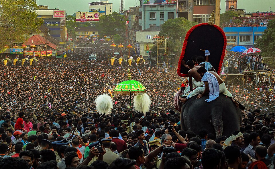 Kudamattam at Thrissur Pooram — the iconic umbrella exchange ceremony between Thiruvambadi and Paramekkavu, Thekkinkadu Maidan