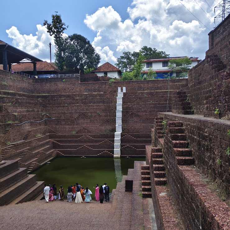 Kerala temple theertham — sacred water from copper vessel