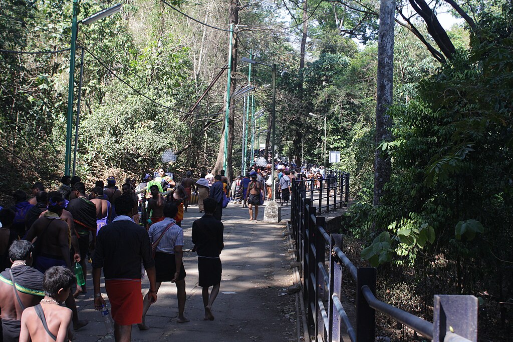 Sabarimala pilgrims on the Pamba pathway through Periyar Tiger Reserve